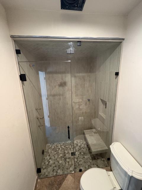 Steam shower with header to ceiling