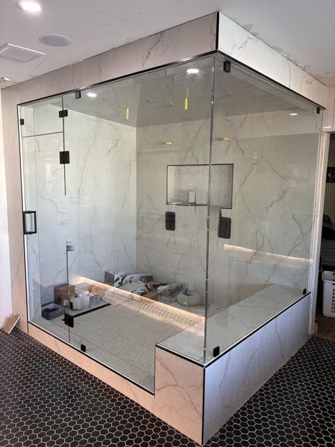 Glass enclosure with lit bench · Matte black
